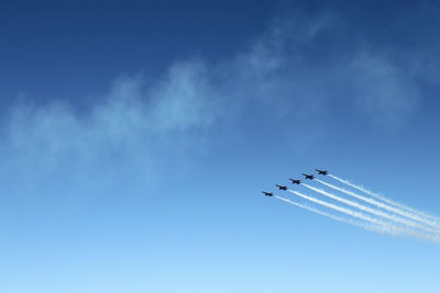 Low angle view of airplane flying in sky