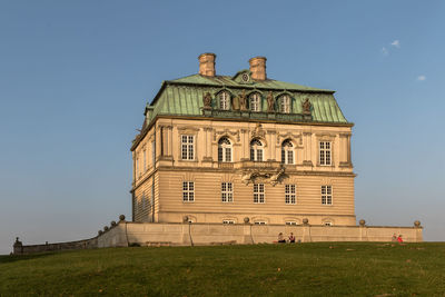 Low angle view of building against clear blue sky