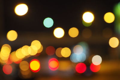 Defocused image of illuminated street lights at night