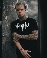 Portrait of young man standing outdoors