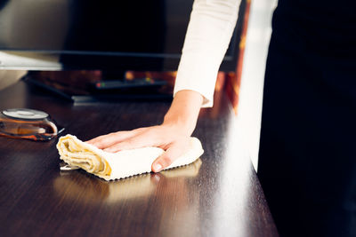 Close-up of hands on table