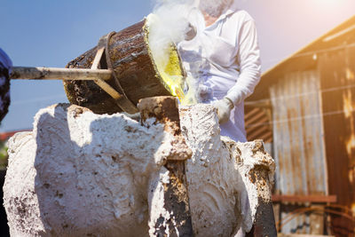 Man working on sculpture