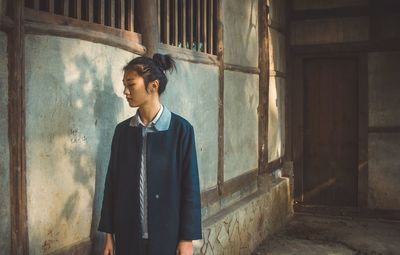 Man standing in front of wall