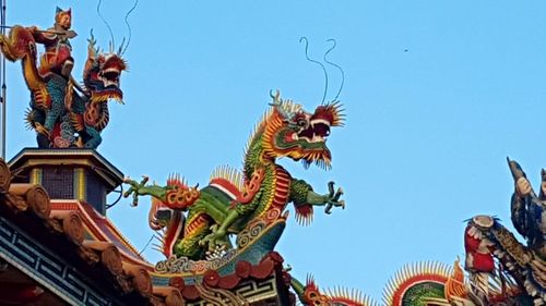 Low angle view of statue against sky