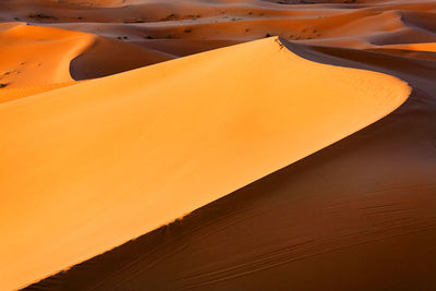 Scenic view of sand dunes at erg chebbi desert during sunset