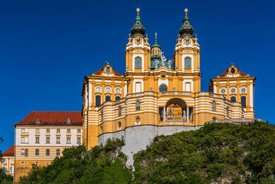 Low angle view of building against blue sky