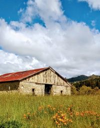 House on field against sky