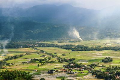 Scenic view of agricultural landscape against sky