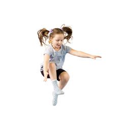 Portrait of smiling young woman exercising against white background