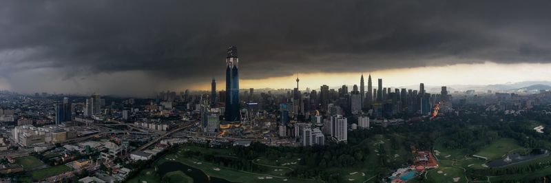 High angle view of buildings in city against sky