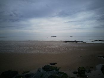 Scenic view of beach against sky