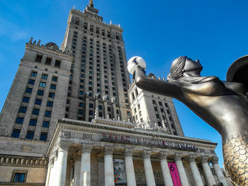 Low angle view of statue of building against sky