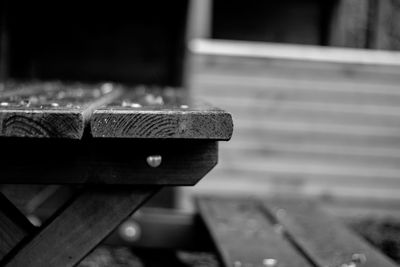 Close-up of old bench on table