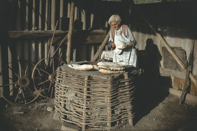 Man working in basket at market