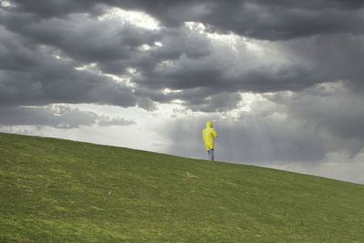 Person on field against sky