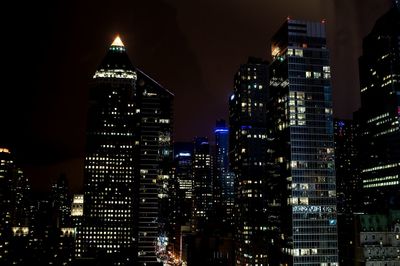 Illuminated buildings in city at night