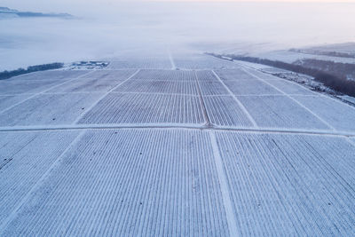 High angle view of land and sea against sky