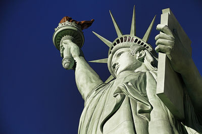 Low angle view of statue against sky