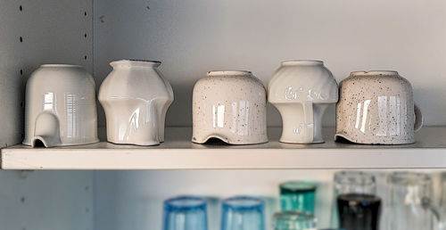 Ceramic utensils kept in shelf