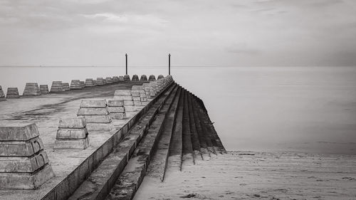 Pier over sea against sky