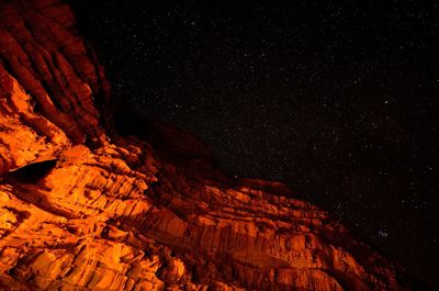 Aerial view of illuminated star field against sky at night