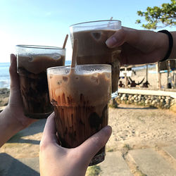 Close-up of hand holding drink