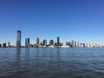 City skyline against blue sky