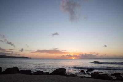 Scenic view of sea at sunset