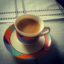 Close-up of coffee cup on table