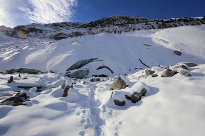 Scenic view of snowcapped mountains against sky