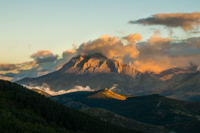 Scenic view of mountains against sky during sunrise