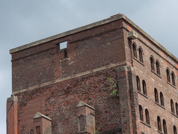 Low angle view of old building against sky