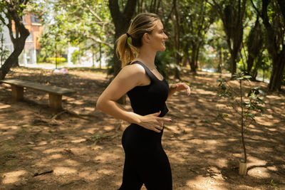 Woman running and jogging at a park outdoors. athlete female person during workout. healthy 