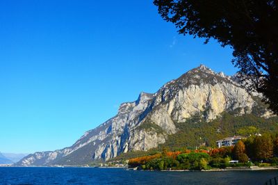 Scenic view of mountains against clear blue sky