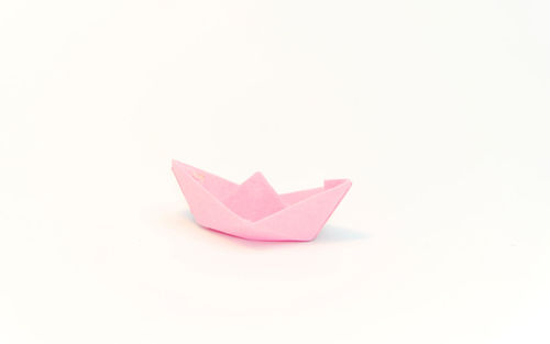 Close-up of paper toy against white background