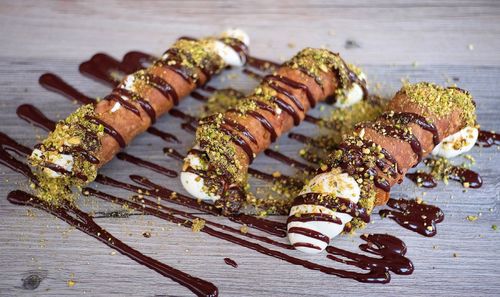 High angle view of cannoli served on table