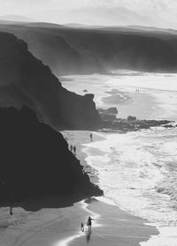 Silhouette people on beach