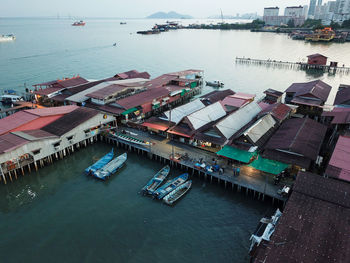 High angle view of boats moored at harbor