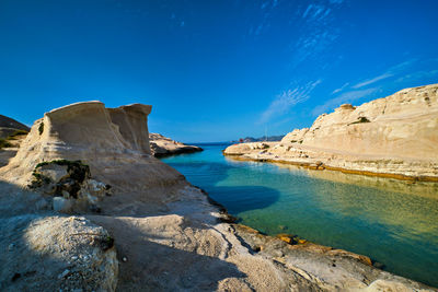 Scenic view of sea against blue sky