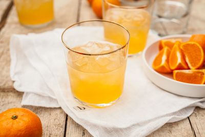 Close-up of orange juice on table