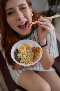 Portrait of woman eating food