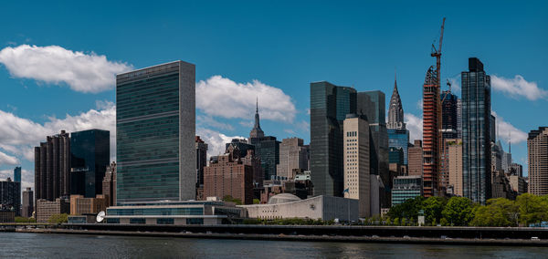 Modern buildings against sky in city