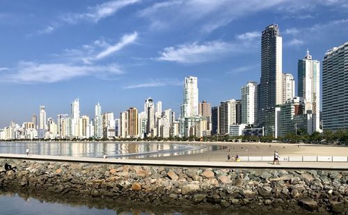 Modern buildings in city against sky