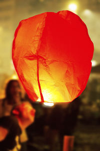 Close-up of hot air balloon against orange sky