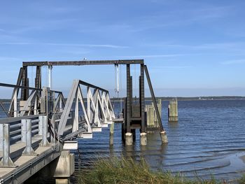 Bridge over sea against sky