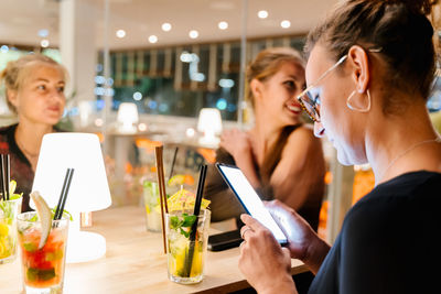 Young woman having food in restaurant
