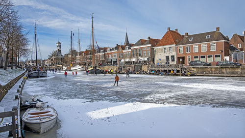 Winter fun on the canals in the city dokkum in the netherlands 