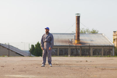 Full length of man standing against sky