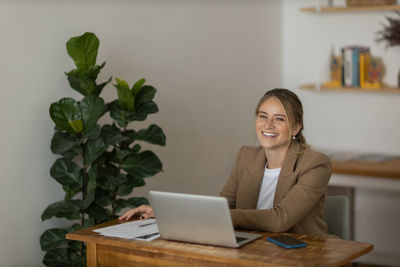 Woman working at home with laptop. home office.  notebook for working. 