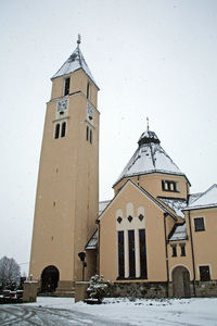 Bell tower against sky during winter